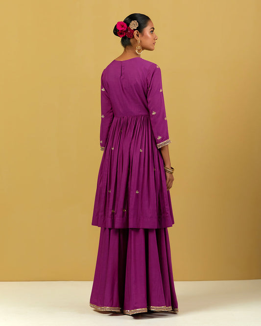 Women Wearing Purple Suit Set