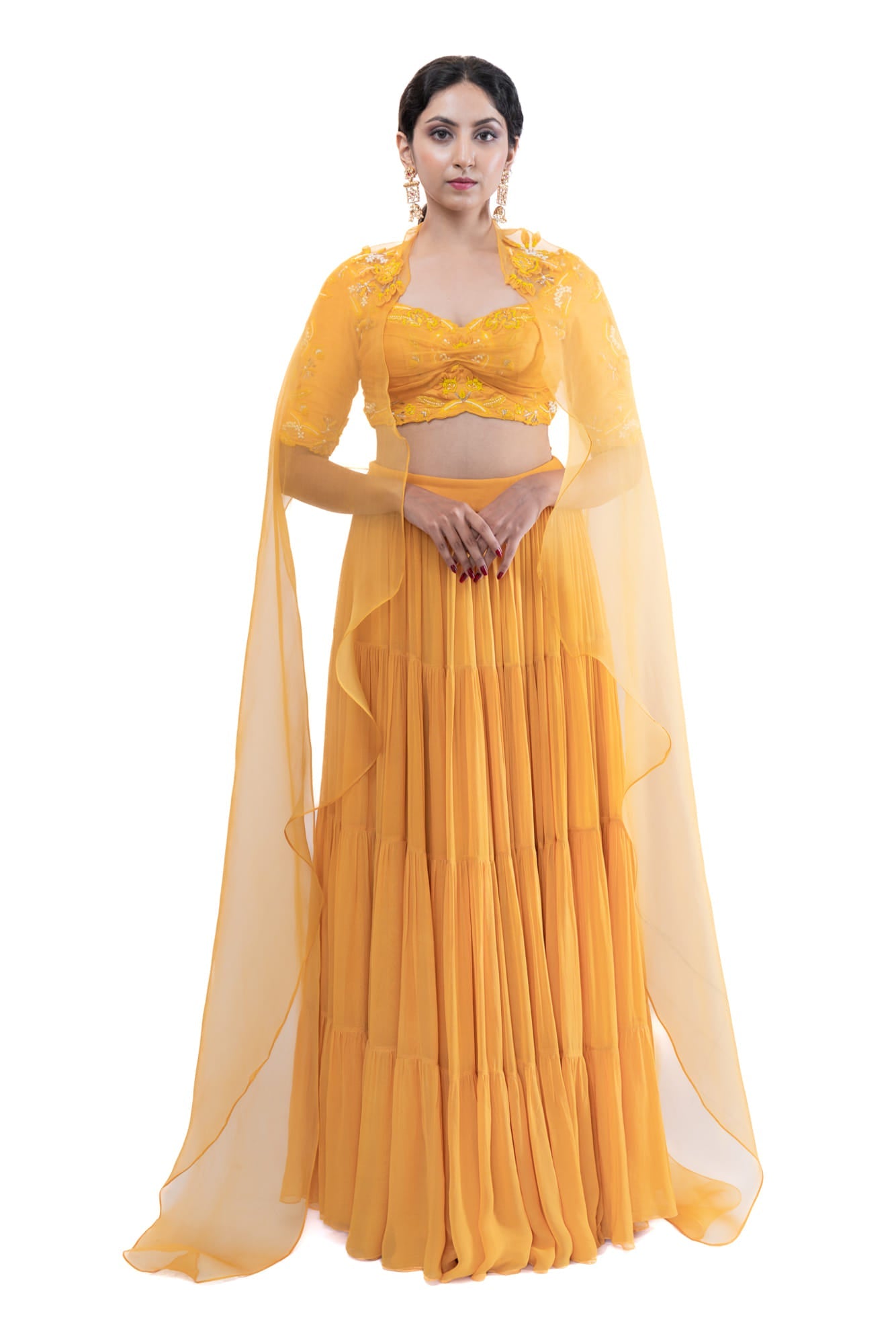 Women Wearing Yellow Lehenga Set.