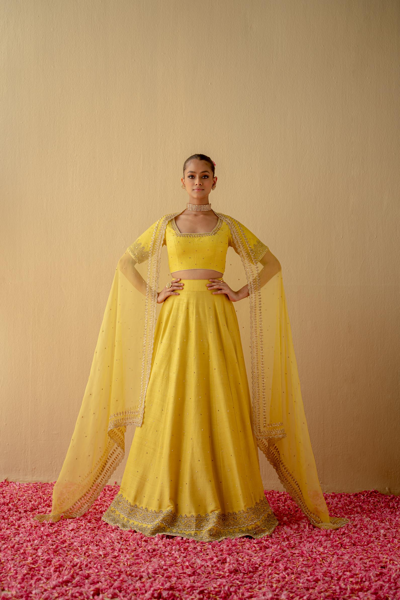 Women Wearing Green Lehenga Set.