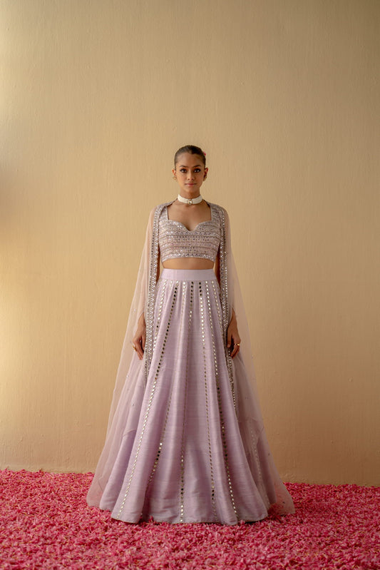 Women Wearing Peach Lehenga Set.