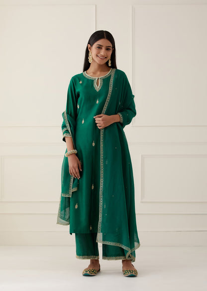 Women Wearing Green Kurta Set.