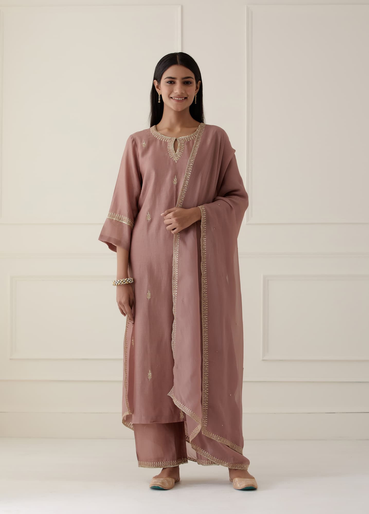 Women Wearing Pink Kurta Set.