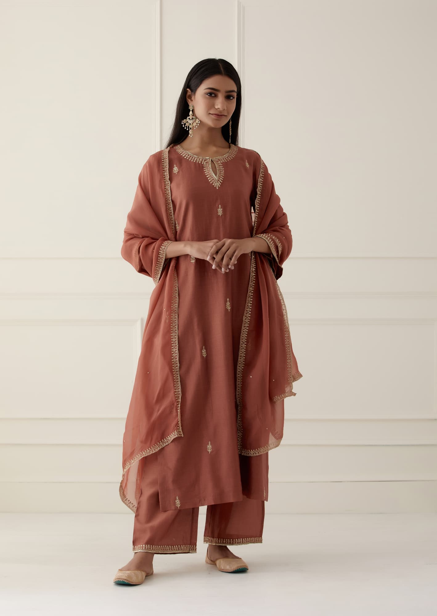 Women Wearing Brown Kurta Set.