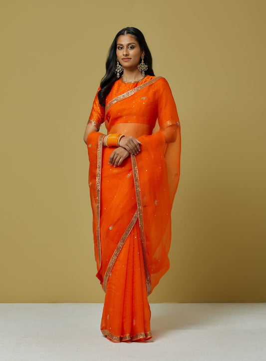 Women Wearing Orange Saree.
