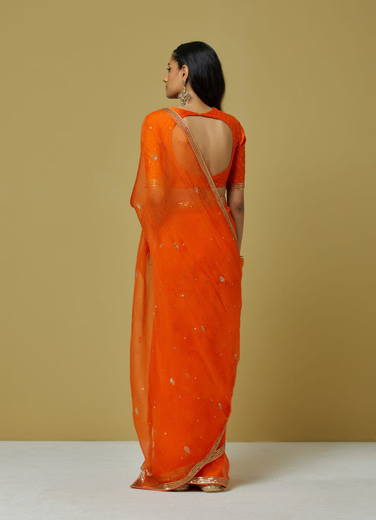Women Wearing Orange Saree.