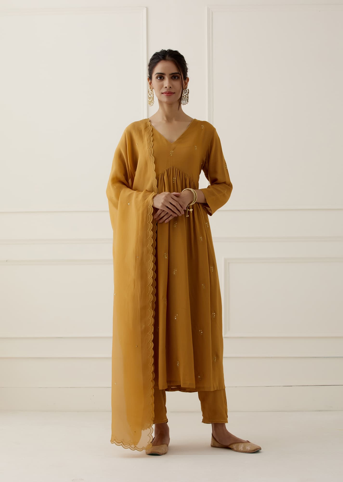 Women Wearing Yellow Kurta Set.