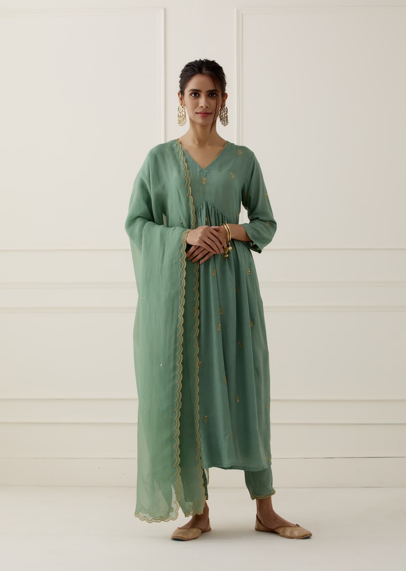 Women Wearing Green Kurta Set.