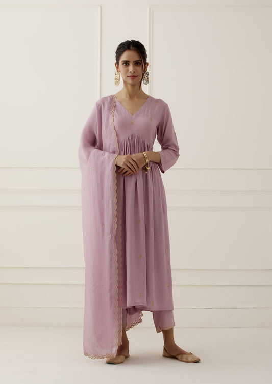 Women Wearing Purple Kurta Set.