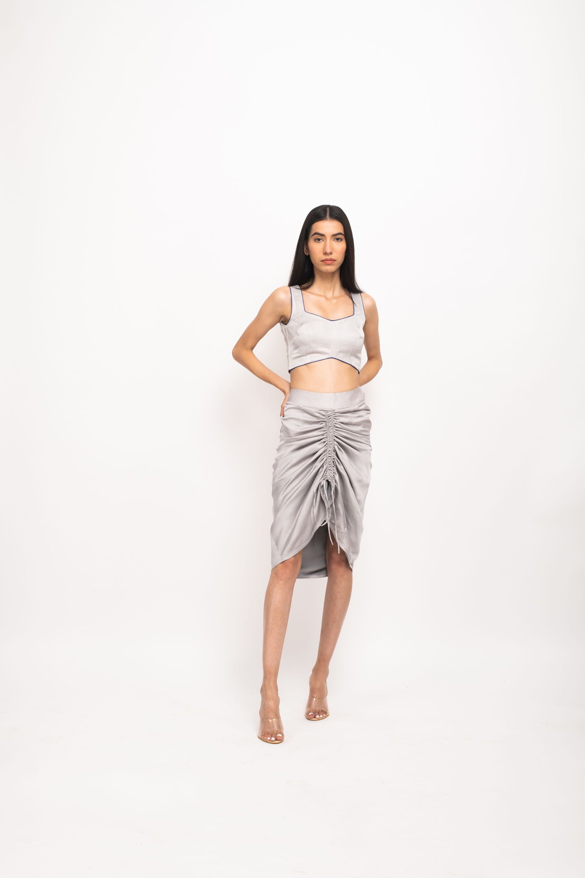 Women Wearing Grey Skirt Set.