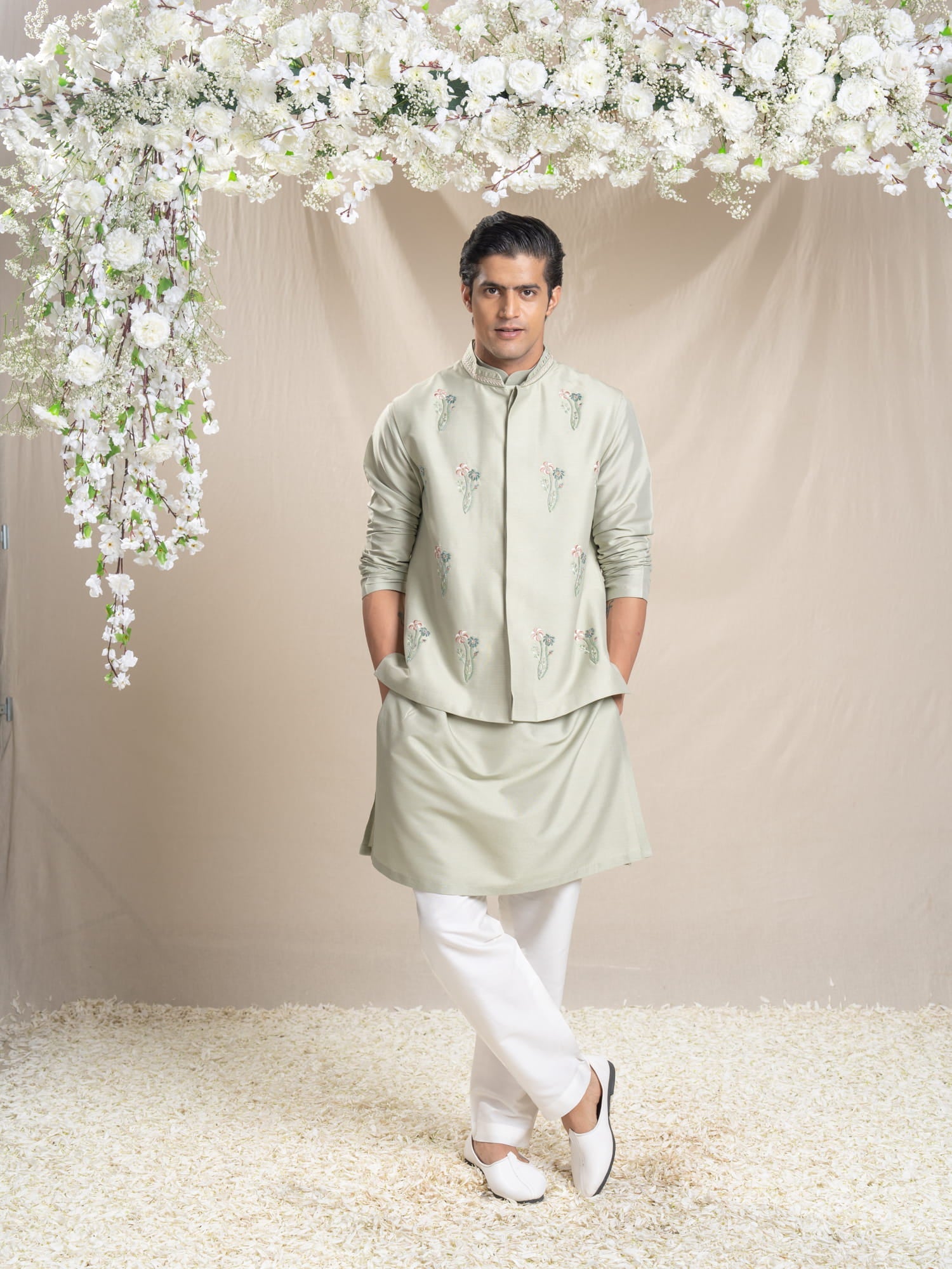 Men Wearin Green Bundi Kurta Set.