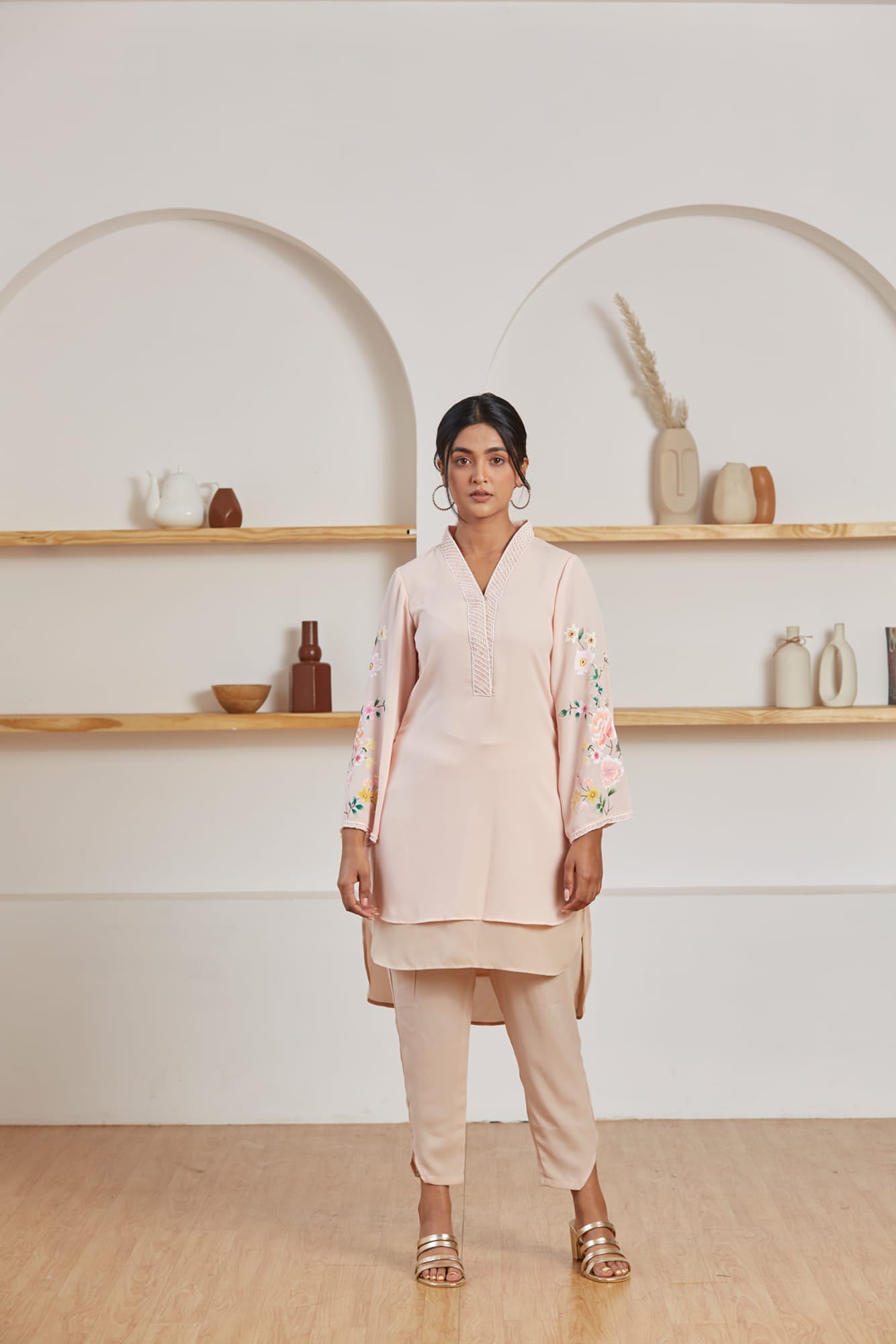 Women Wearing Peach Kurta Set. 