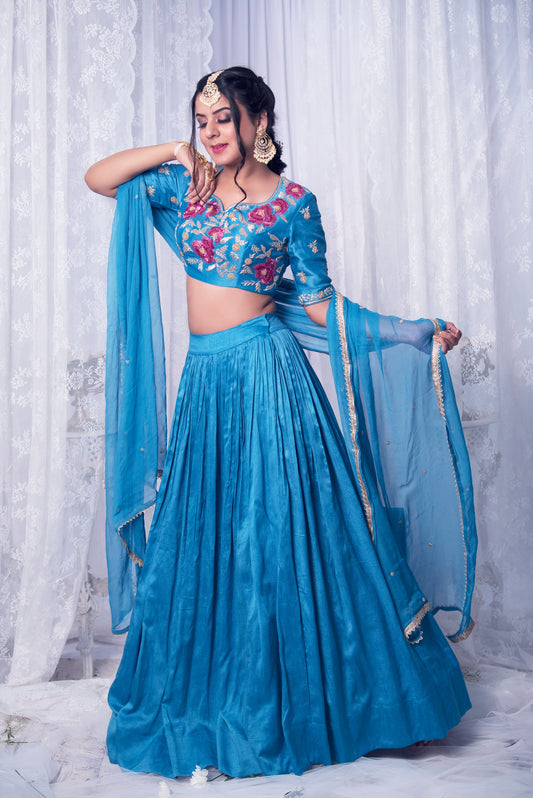 Women Wearing Blue Lehenga Set.