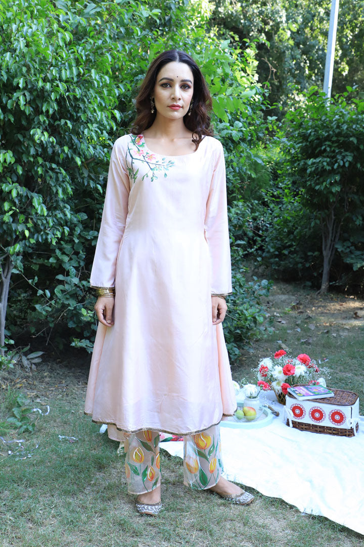 Women Wearing Peach Kurta Set.