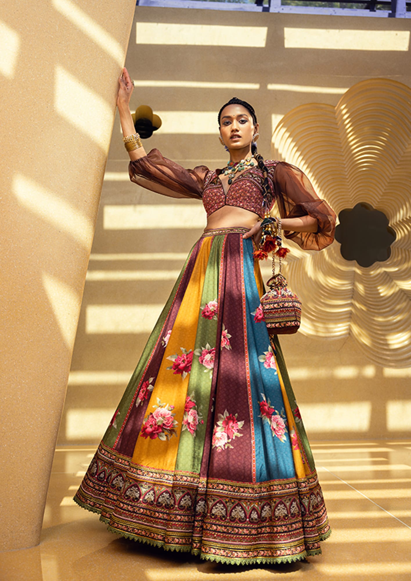 Women Wearing Multi Color Lehenga Set.