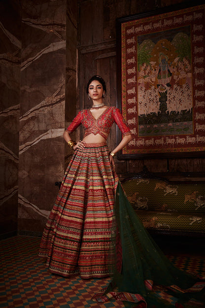 Women Wearing Red Lehenga Set.