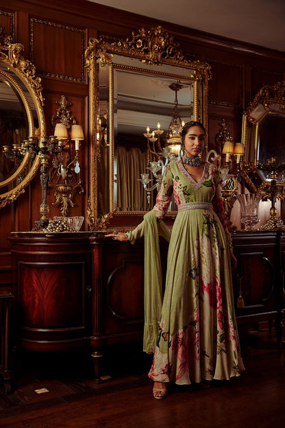 Women Wearing Green Anarkali Set With Net Dupatta.