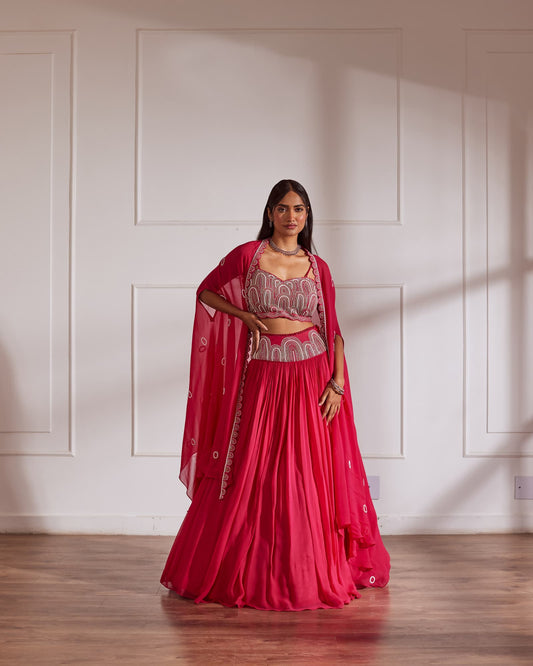 Women wearing Fuscia Lehenga set