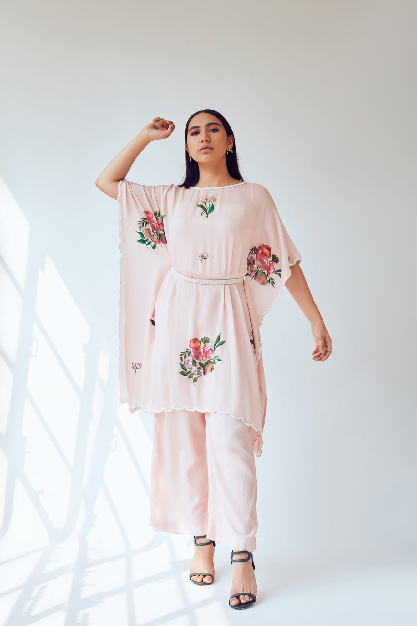 Women Wearing Pink Kaftan Set.