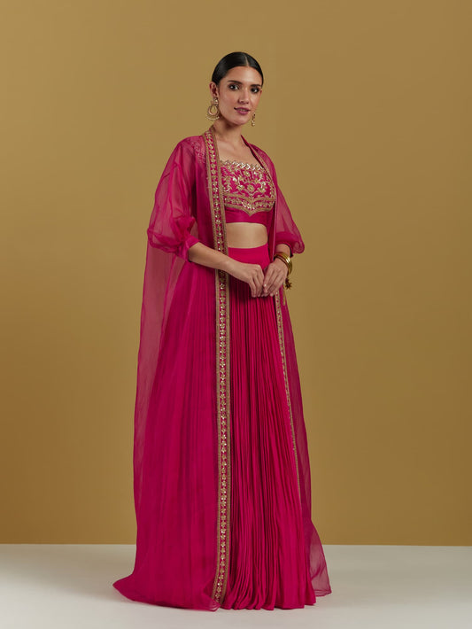 Women Wearing Pink Lehenga Set.