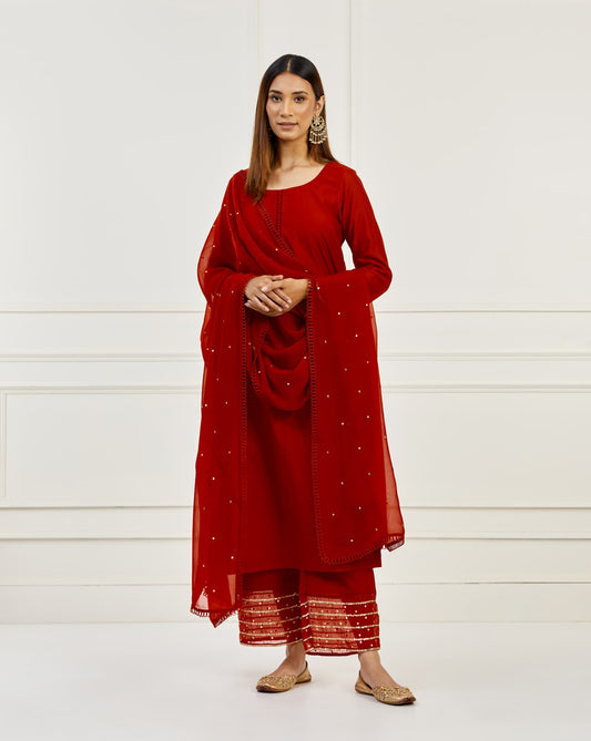 Women Wearing Red Kurta Set.