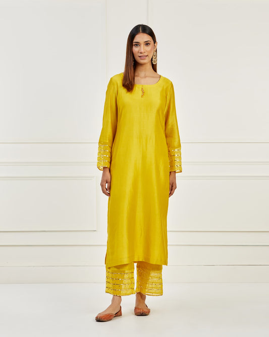 Women Wearing Yellow Kurta.