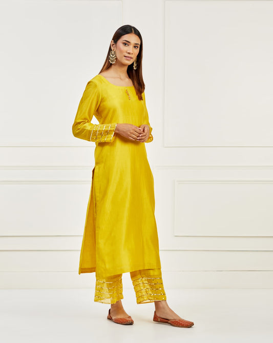 Women Wearing Yellow Kurta With Pant.